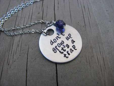 Don't Grow Up It's A Trap Inspiration Necklace- "don't grow up it's a trap" - Hand-Stamped Necklace with an accent bead in your choice of colors